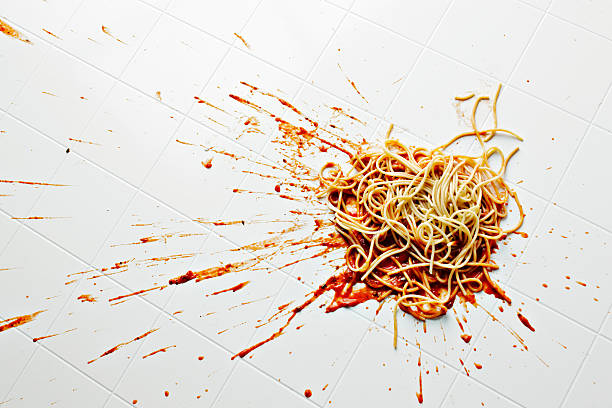 spaghetti and sauce spilled on kitchen floor - food stock pictures, royalty-free photos & images