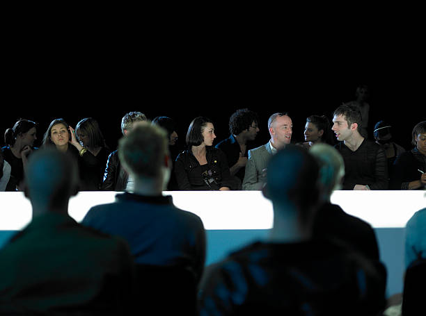spectators sitting by catwalk at fashion show - fashion stock pictures, royalty-free photos & images