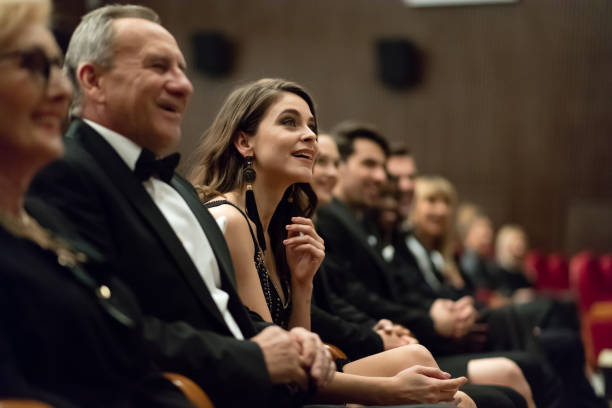 spectators sitting in the theater - concert stock pictures, royalty-free photos & images