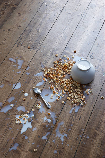 spilled breakfast cereal on floor - food stock pictures, royalty-free photos & images