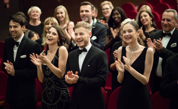standing ovation in theatre - concert stock pictures, royalty-free photos & images