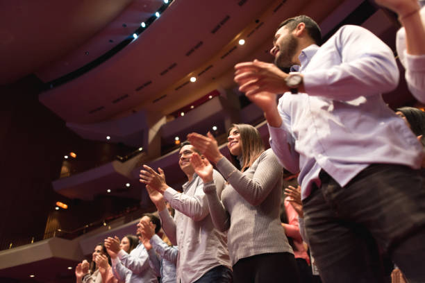 standing ovation on the public after a beautiful ballet performance - concert stock pictures, royalty-free photos & images