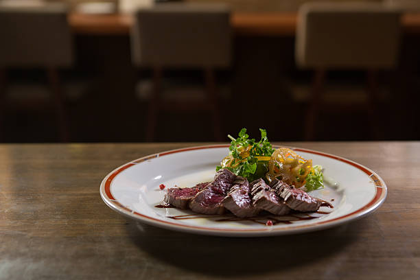 steak dinner on a restaurant table - food stock pictures, royalty-free photos & images