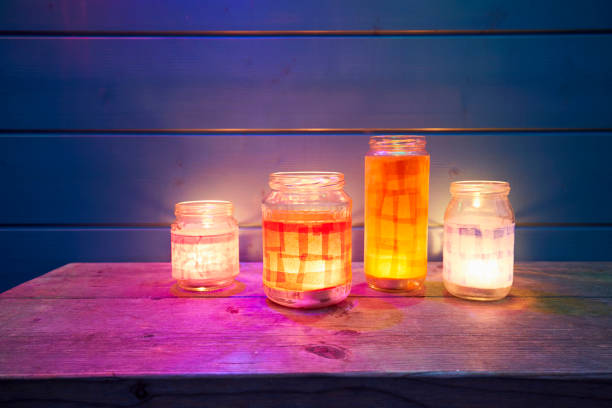 still life of handmade lanterns on table against blue wooden wall - garden decoration stock pictures, royalty-free photos & images