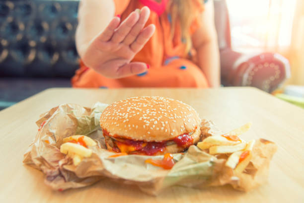 stop unhealthy foods. - junk food stock pictures, royalty-free photos & images