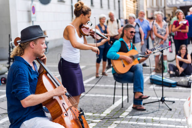 street musician at lucerne, switzerland - concert stock pictures, royalty-free photos & images