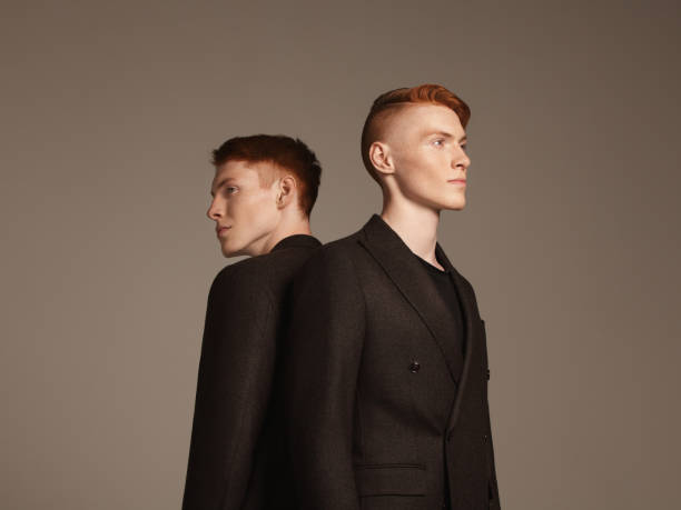 studio portrait of twins - fashion stock pictures, royalty-free photos & images