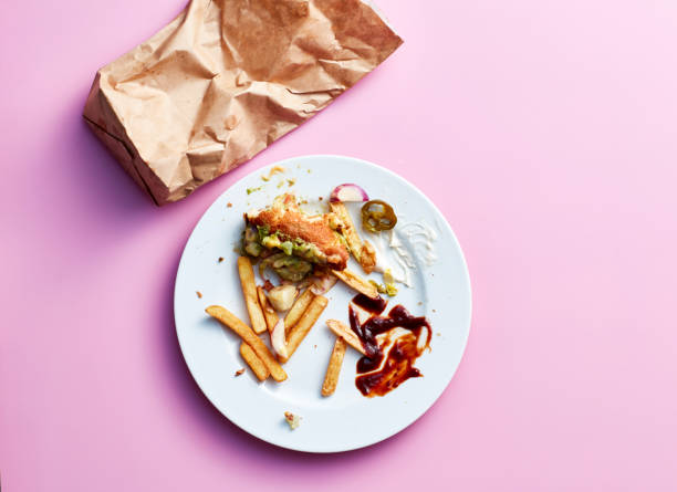 studio shot of half eaten fast food meal - junk food stock pictures, royalty-free photos & images