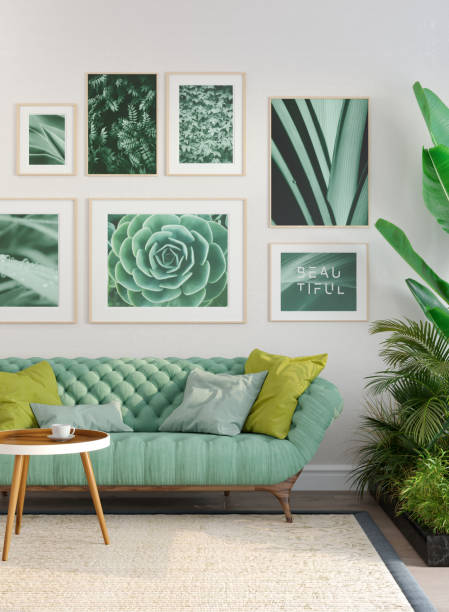 stylish living room with green sofa and posters - home decoration stock pictures, royalty-free photos & images