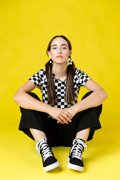 stylish woman in front of plain background - fashion stock pictures, royalty-free photos & images