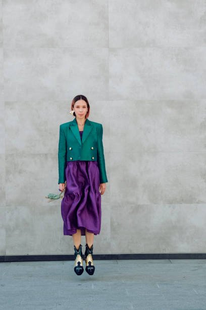 stylish young woman jumping on city wall background. - fashion stock pictures, royalty-free photos & images