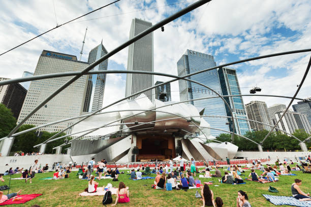 summer concert at the millennium park in downtown chicago - concert stock pictures, royalty-free photos & images