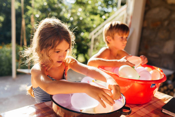 summer water bombs refresment - garden decoration stockfoto's en -beelden