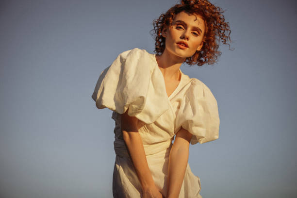 sunlit confidence - fashion stock-fotos und bilder