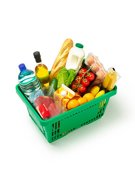 supermarket basket with organic produce on white. - food stock pictures, royalty-free photos & images