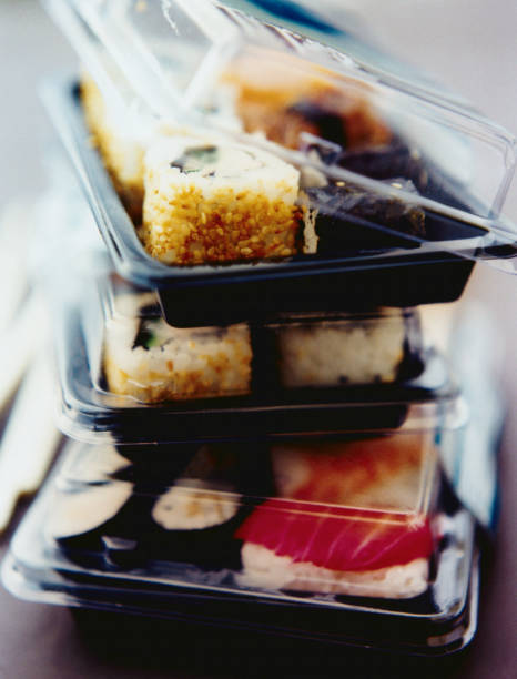 sushi in box lunches - junk food stock pictures, royalty-free photos & images