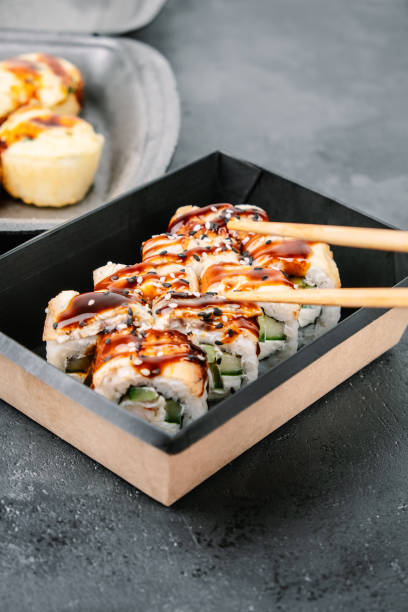 sushi roll set in containers. takeaway sushi. - junk food stock pictures, royalty-free photos & images