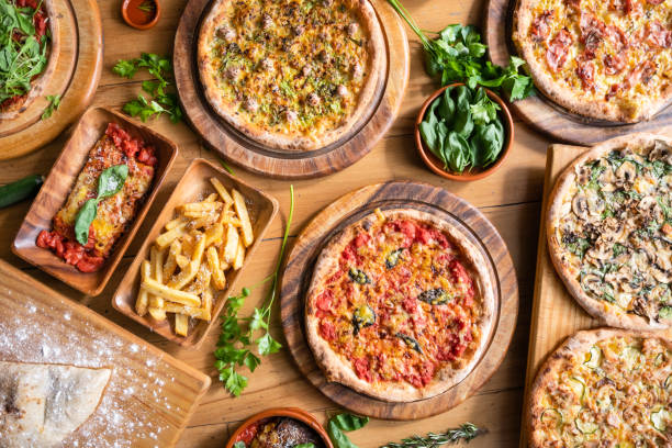 table top view of italian pizza. - junk food stock pictures, royalty-free photos & images