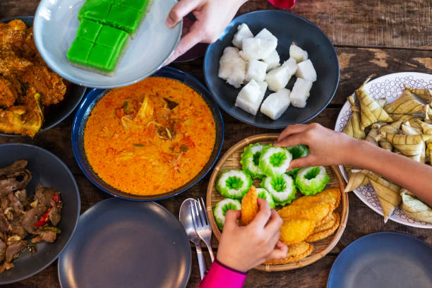 tabletop view of kuih (malay cake) and malay dishes food - food stock pictures, royalty-free photos & images