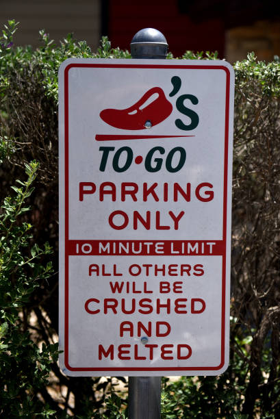 Take-out only parking sign stands at a Brinker International Inc. Chili's Grill & Bar restaurant in San Antonio, Texas, U.S., on Monday, May 7, 2018....