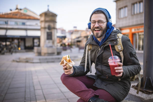 taking a break for street food - junk food stock pictures, royalty-free photos & images