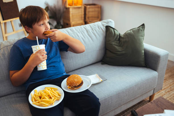 taking a huge bite - junk food stock pictures, royalty-free photos & images