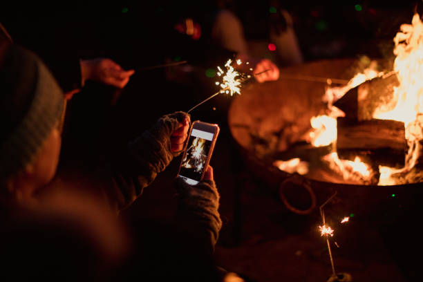 taking a photo of sparklers - garden decoration stock pictures, royalty-free photos & images