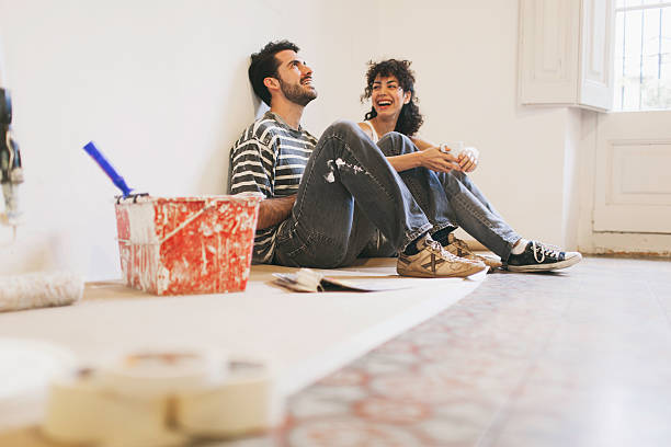 taking a rest after painting apartment. - home decoration stock pictures, royalty-free photos & images