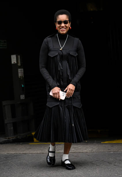 Tamu McPherson is seen wearing a black Sacai ruffled outfit outside the Sacai show during Womenswear Spring/Summer 2025 as part of Paris Fashion Week...