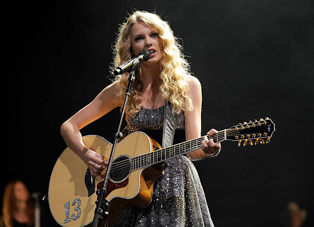 Taylor Swift performs onstage at the "We're All For The Hall" benefit concert for the Country Music Hall of Fame at the Sommet Center on October 13,...