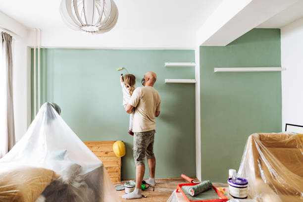 teamwork in house renovation - daddy and daughter painting together - home decoration stock pictures, royalty-free photos & images