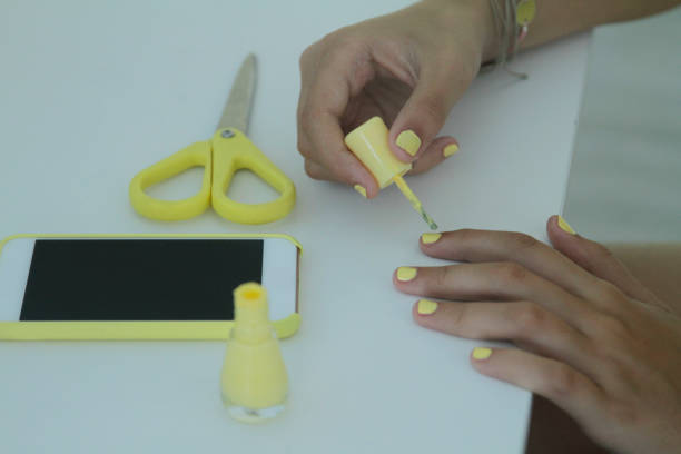 teen girl painting her fingernails - nails art stock pictures, royalty-free photos & images