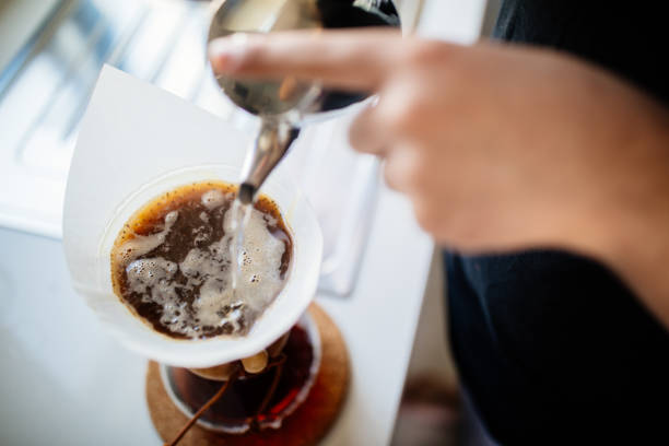 teenage brewing coffee at home - coffee stock pictures, royalty-free photos & images