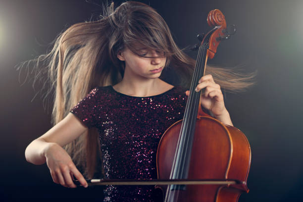teenage girl playing cello performance - concert stock pictures, royalty-free photos & images