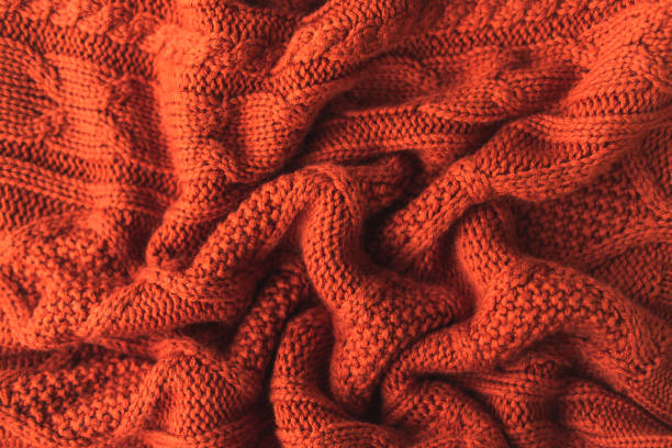 texture of a knitted red brown sweater with pleats. flat style, close-up. - home decoration stock pictures, royalty-free photos & images