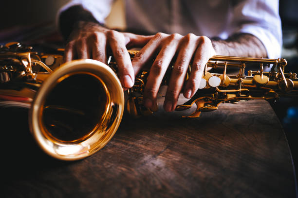 the hands of the saxophone player - concert stock pictures, royalty-free photos & images