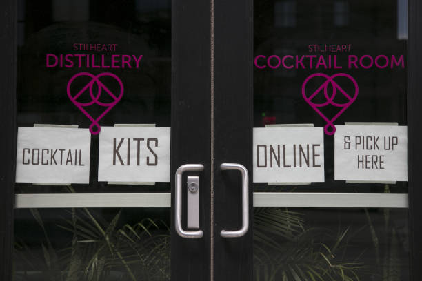 The Stilheart Distillery displays signs offering take-out cocktail kits in the North Loop neighborhood of Minneapolis, Minnesota, U.S., on Saturday,...