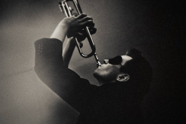 the trumpet player at the jazzclub - concert stock pictures, royalty-free photos & images