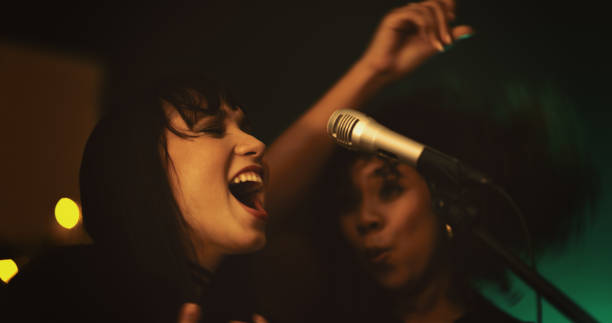 these ladies know how to bring life to the party - concert stock pictures, royalty-free photos & images