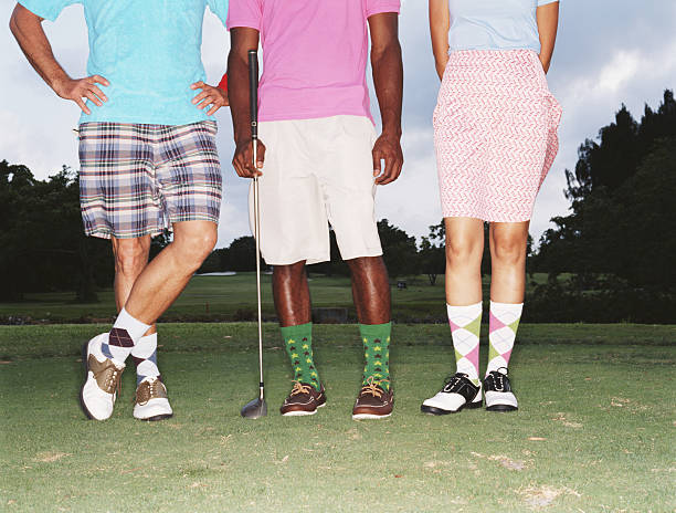 three golfers standing in row on golf course, low section - fashion stock pictures, royalty-free photos & images