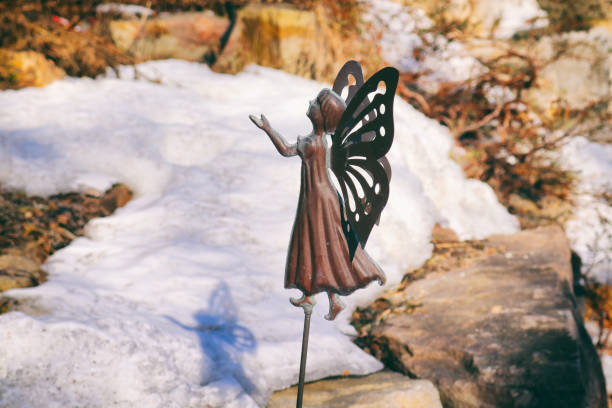 tiny fairy of winter garden - garden decoration stock pictures, royalty-free photos & images