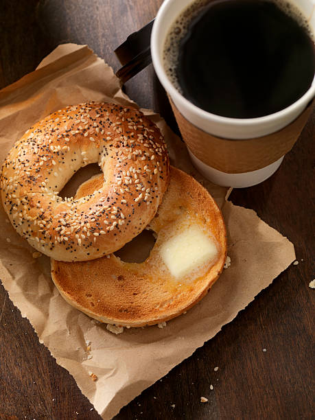 toasted bagel with butter - junk food stock pictures, royalty-free photos & images