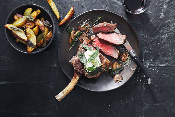tomahawk beef steak with mushrooms, burrata and sage potato wedges - food stock pictures, royalty-free photos & images
