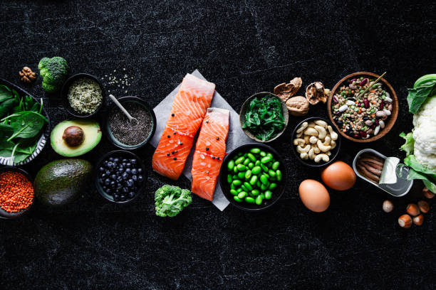 top view of omega 3 food items on black table - food stock pictures, royalty-free photos & images