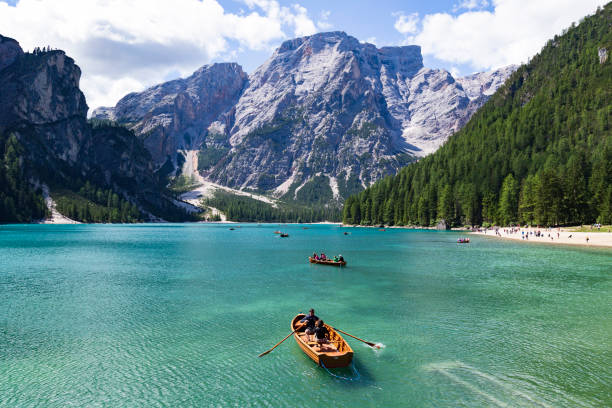 tourism sailing boat in lake braies, dolomite, italy. - travel stock pictures, royalty-free photos & images