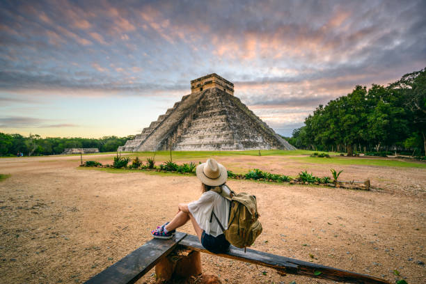 tourist exploring chichen-itza archaeological site, yucatan, mexico - travel stock pictures, royalty-free photos & images