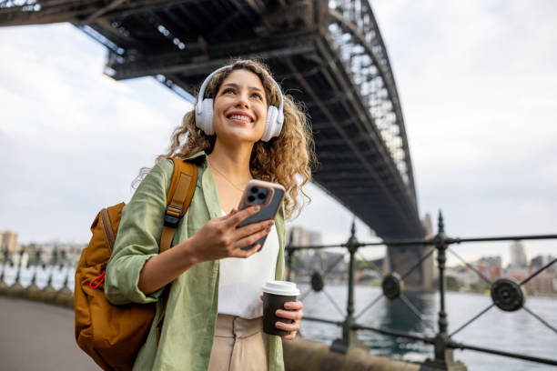 tourist sightseeing in sydney under the harbor bridge - travel stock pictures, royalty-free photos & images