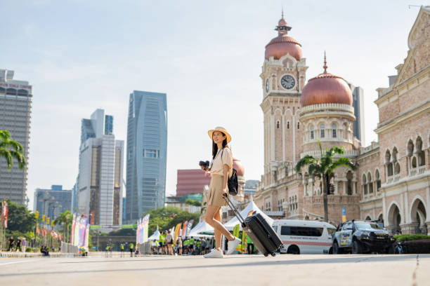 tourist wandering around kuala lumpur - travel stock pictures, royalty-free photos & images
