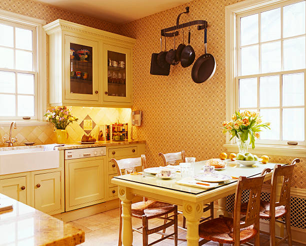 traditional country kitchen with cane seat chairs at table - home decoration stock pictures, royalty-free photos & images