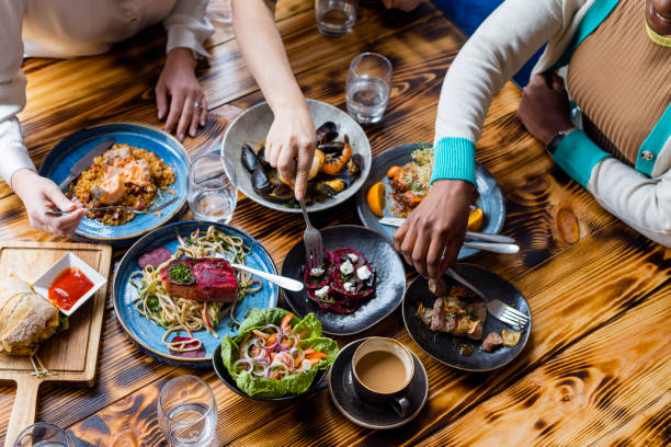 trying a bit of everything - food stock pictures, royalty-free photos & images